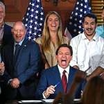 image for Ron DeSantis laughs after signing the bill removing funding for equity programs in Florida colleges