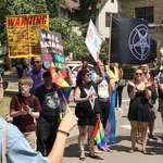 image for Group of satanists in front of one religious protester at Rochester pride.