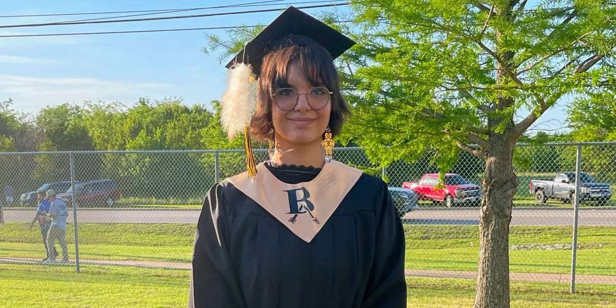 image for Oklahoma school officials tried to rip a Native American student's sacred feather off her cap at graduation, lawsuit alleges