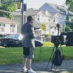 image for This man I saw doing a news report with his iPhone in shorts and a blazer