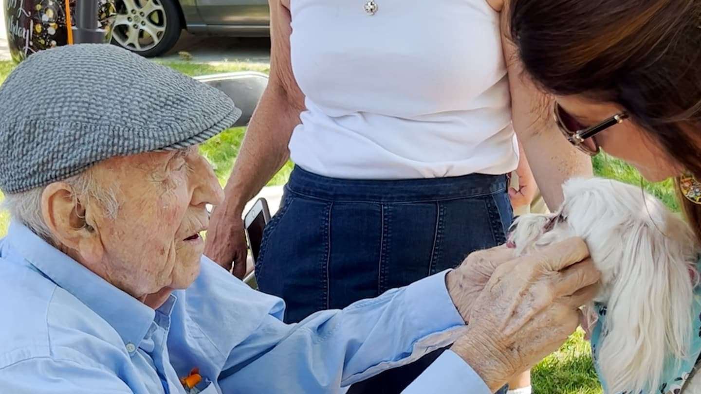 image for He wanted to pet dogs for his 100th birthday. Hundreds lined up.