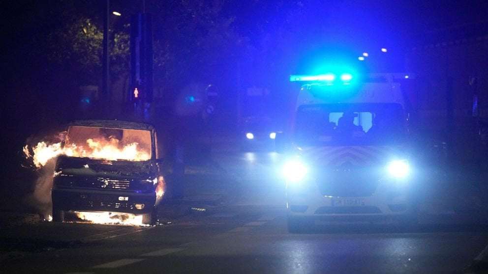 image for Mourners bury slain teen as Macron scraps trip, officials again deploy tens of thousands of police