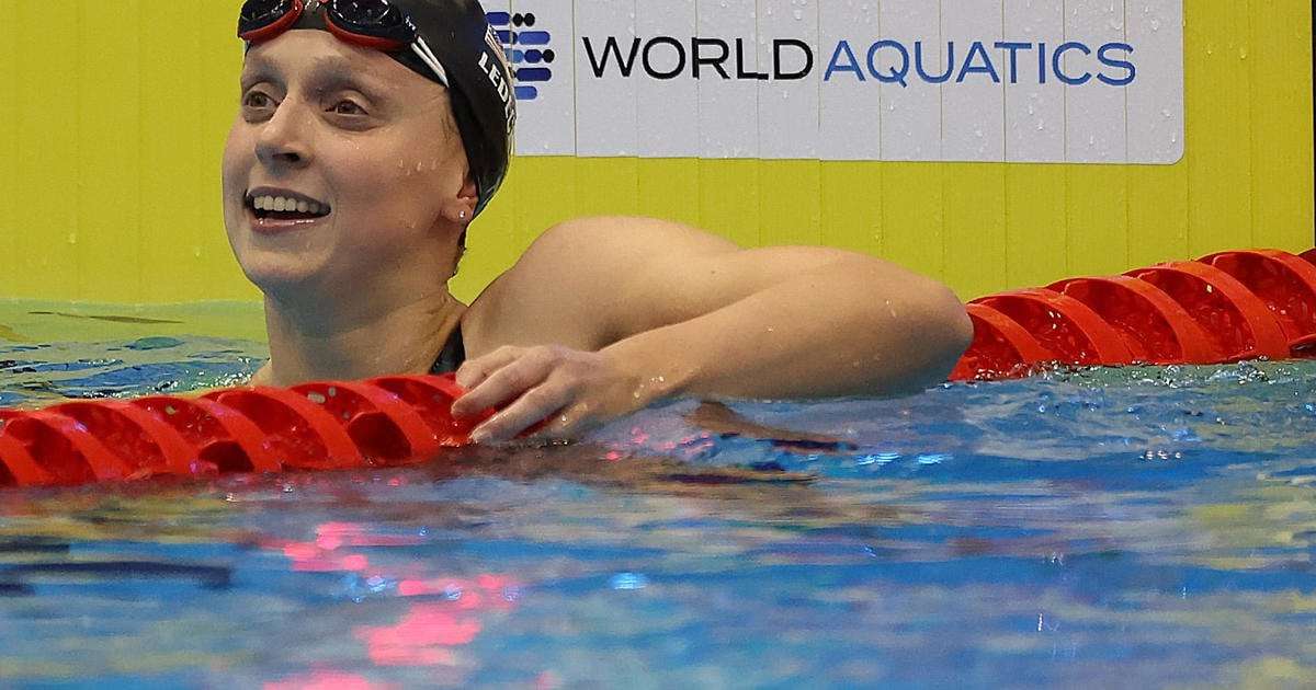 image for Katie Ledecky breaks Michael Phelps' record for most individual world titles