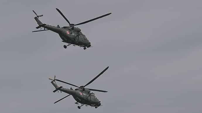 image for Poland deploys attack helicopters to border with Belarus