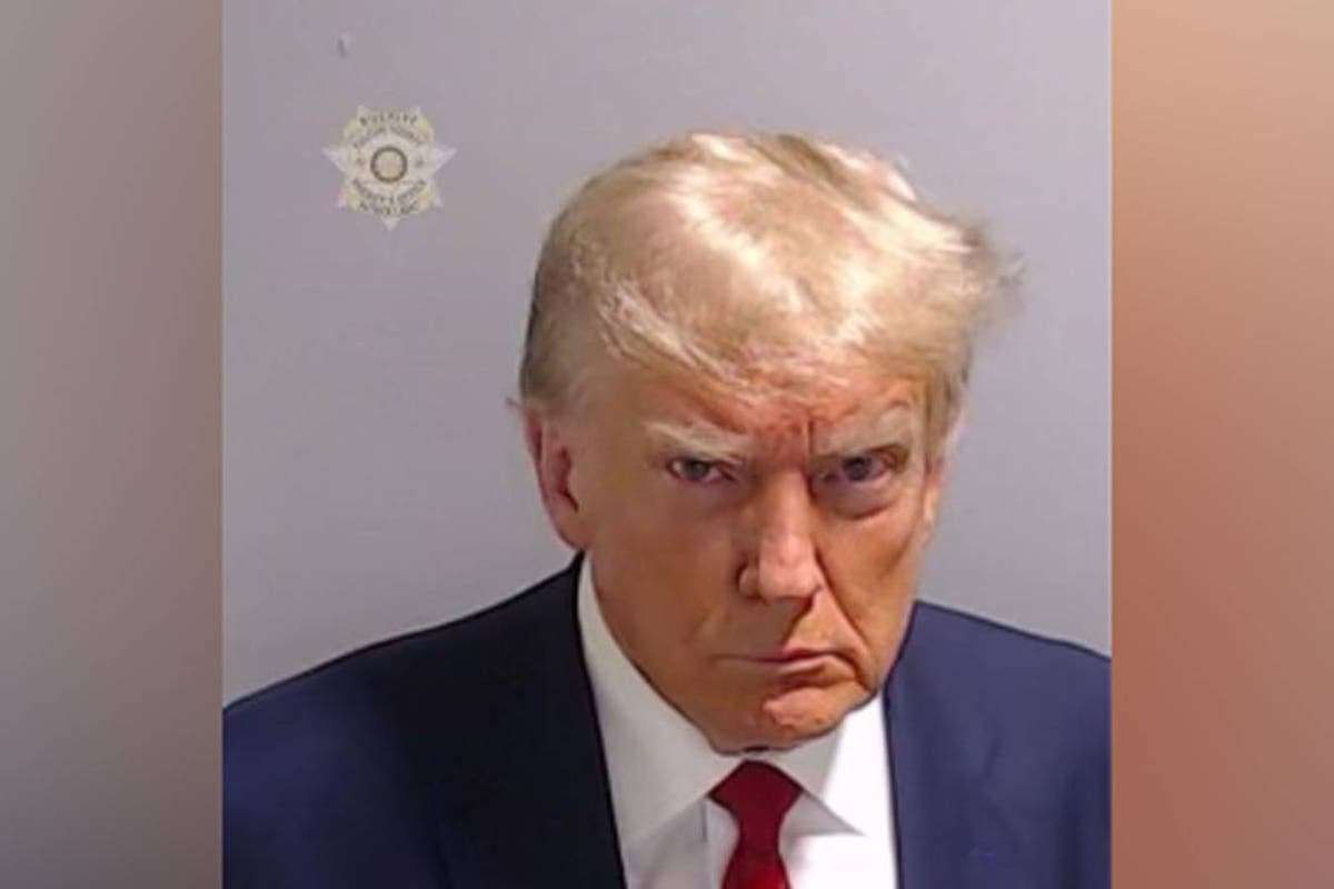 image for Trump scowls in historic mug shot after arrest at Fulton County Jail