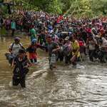 image for Migrants wading through the jungle to come to the United States.