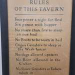 image for Sign in old bar bathroom that was a hotel in the 1800s. Tinkers & grinders weren't welcome.