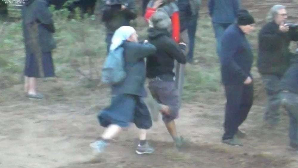 image for Nun rugby tackles environmental activist as protest over new church turns violent