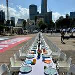image for Tel Aviv: A Shabbat dinner table for the hostages along with high chairs for missing babies
