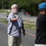 image for [NSFW]The moment a 77 year old man opens fire at an environmental activist that is blocking the road