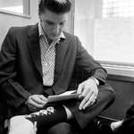 image for 1956 On the train from Richmond, Virginia to New York, Elvis reads a fan letter to DJ Fontana