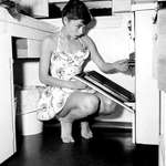 image for Audrey Hepburn opening an oven, 1950s