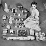image for A housewife poses with a week's worth of groceries in 1947.