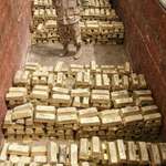 image for American soldier standing in a truck loaded with gold recovered from Saddam Hussein - Iraq, 2003.