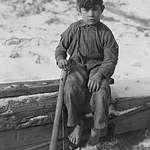 image for Barefoot boy digging coal from refuse on the snowy road side. Scott’s Run, WV, 1936