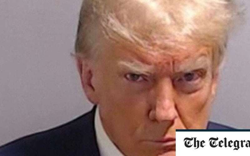 image for Donald Trump sells cut-up pieces of suit he wore in mugshot – for $5,000