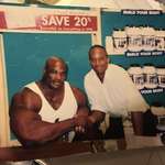 image for Ronnie Coleman next to a regular sized man.