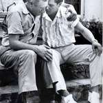 image for Elvis Presley comforting his father upon the passing of his (Elvis) mother in 1958.