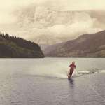 image for Teenager water skiing on may 18, 1980 as Mount St Helens erupts in the background.