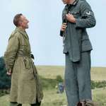 image for A 7’3” German soldier chatting with a 5’3” British officer after surrendering to him during WW2