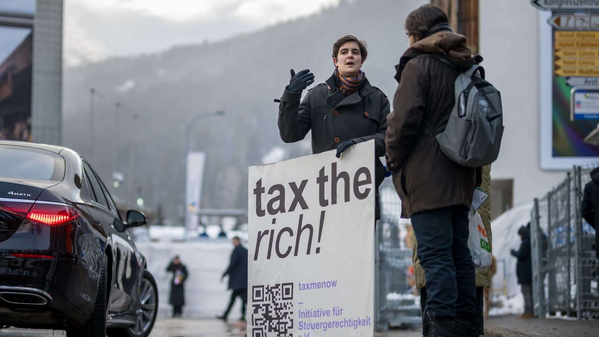 image for Mega-rich renew call on global leaders at Davos to 'tax our extreme wealth'