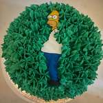 image for 'Homer Simpson disappearing into a hedge' cake with a buttercream hedge