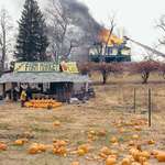 image for Firefighter purchases a pumpkin on a break from fighting a fire, Joel Sternfeld, Virginia 1978