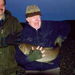 image for President Jimmy Carter struggles to handle a large trout