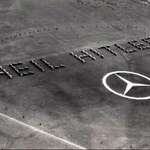 image for Mercedes-Benz greets Nazi airplanes with a “Heil Hitler!” salute at the Daimler-Benz factory, 1936.