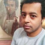 image for An Egyptian man taking a selfie with a 2000 years old Roman era portrait of an Egyptian man.
