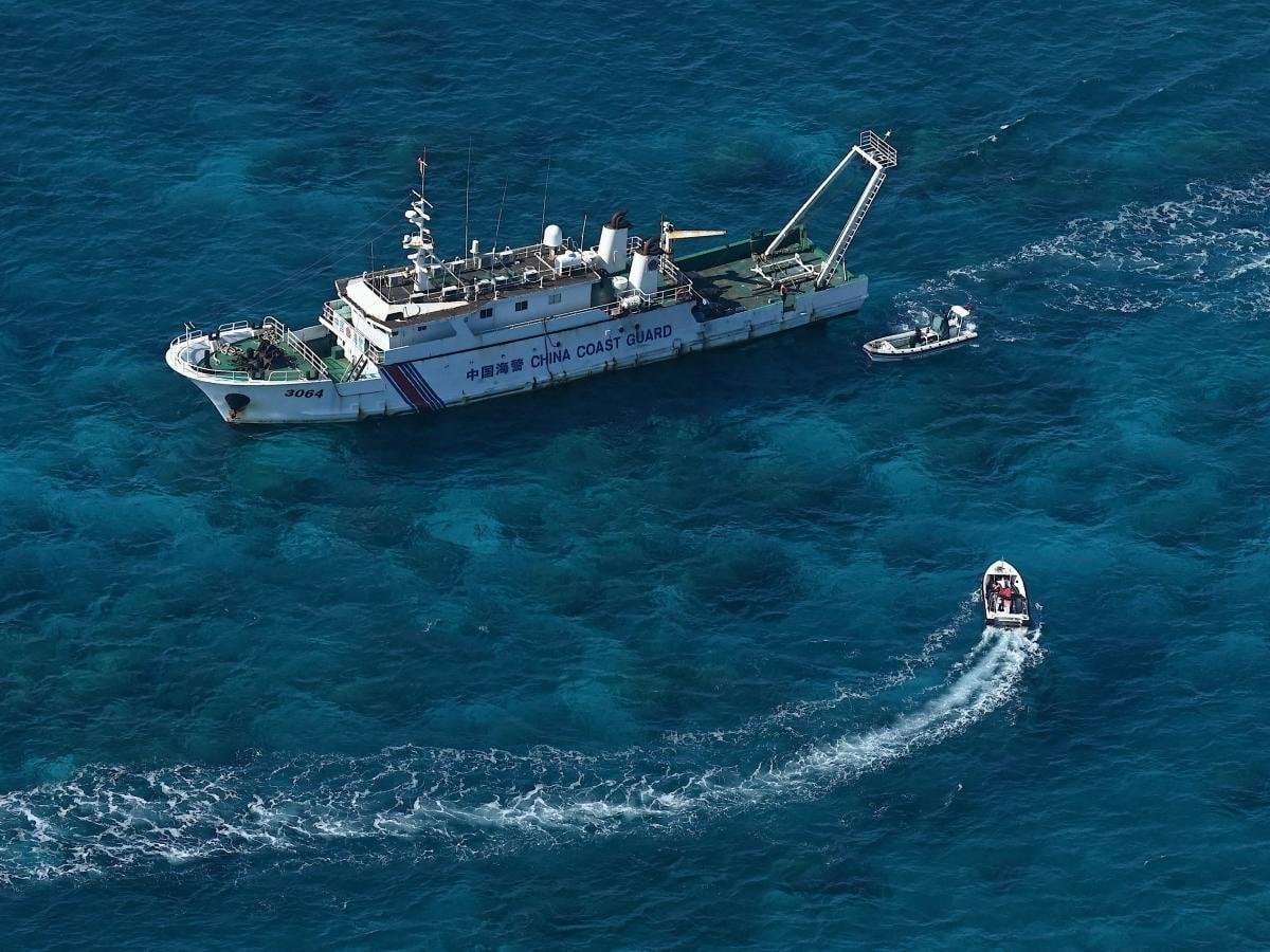 image for Chinese fishing vessels are going scorched earth and pumping cyanide into contested waters, Philippine fishing authority says