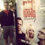 image for Jim Parsons excitedly standing next to a poster for TBBT sometime before the release of season one.