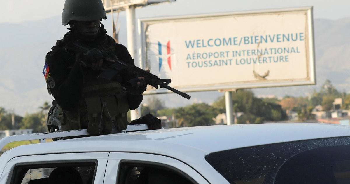 image for Gangs in Haiti try to seize control of main airport as thousands escape prisons: "Massacring people indiscriminately"