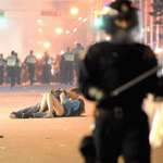 image for Couple kisses during the Stanley Cup riots in Vancouver.