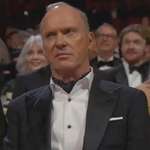 image for Michael Keaton at 2024 Oscars watches presentation by Danny DeVito and Arnold Schwarzenegger