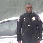 image for Alabama police officer stands in rain to pay respect for WWII veteran
