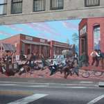 image for Mural in my hometown commemorating a fatal 1889 riot over taxes levied on donkey carts