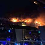 image for The roof of Crocus City Hall (Moscow) is burning after terrorist attack and some explosions indoor