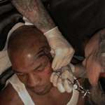 image for Mike Tyson Getting Iconic Face Tattoo - 2003