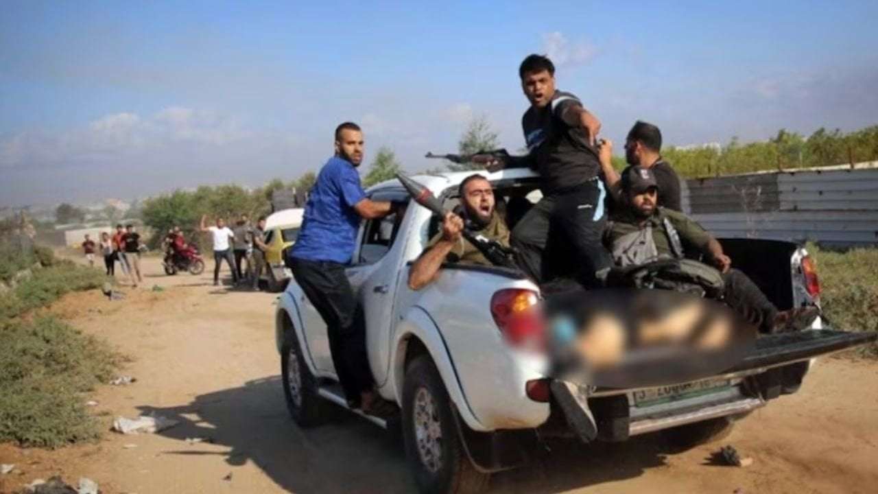 image for Pic of Hamas terrorists parading naked body of woman wins award, ignites anger