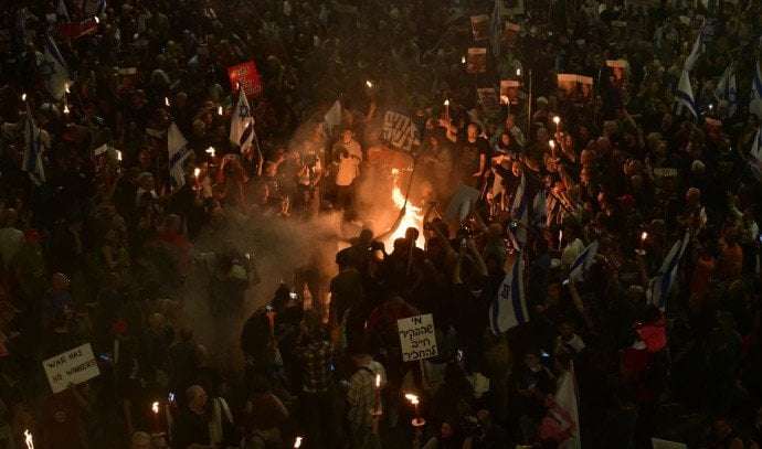 image for Thousands of Israelis block highways, call for hostage release and new elections