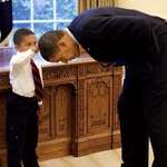 image for “Hair Like Mine,” a 2009 photo of a boy touching Barack Obama’s head