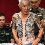 image for Yakuza boss being arrested in Thailand after photos of his tattoos went viral online (2018)