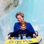 image for Princess Diana on a water slide with her son Harry at an amusement park in 1992