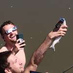 image for Man shows eclipse to his fish