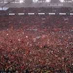 image for Bayer Leverkusen fans storm the pitch after the club wins their first ever league title.