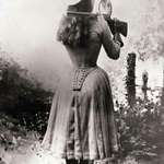 image for Sharpshooter Annie Oakley shooting over her shoulder using a hand mirror 1899