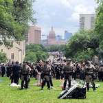 image for Riot Police form a defensive line at the University of Texas at Austin