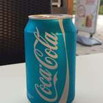 image for The coke can is not red in this image.