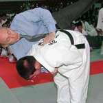 image for Vladimir Putin was pictured getting thrown like a rag doll during a visit to a judo school (2000).